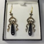 A pair of drop earrings set with diamonds and jet, boxed