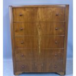 A mid century walnut chest of five drawers, raised on bracket feet, with label for Austinsuite, H.