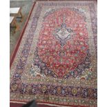 A Central Persian Kashan carpet, central double pendant medallion with repeating petal motifs on a