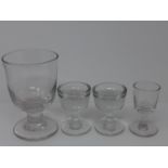 Four Georgian glasses, including a large rummer, H.14cm, a pair of two penny licks, H.8.3cm, and a