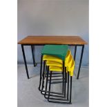 A 20th century hardwood table, together with four bar stools by Metalliform (three yellow, one