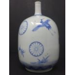 A Japanese sprinkler pot blue motifs on white glazed body, H. 15 cm