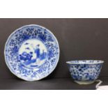 A Chinese tea cup and saucer, blue and white porcelain, saucer 4 inches diameter, central design