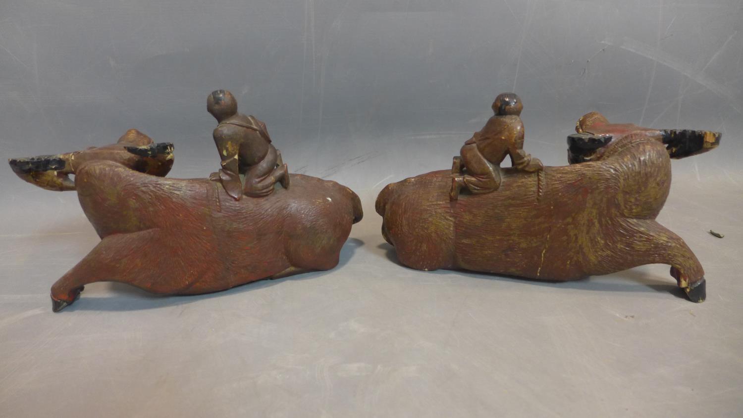 Two Chinese wooden sculptures of a child riding on water buffalo, second half 19th century - Image 4 of 4