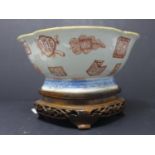 A Chinese four lobed bowl with seal under, with turquoise glazed interior and red ?chop? motifs on a