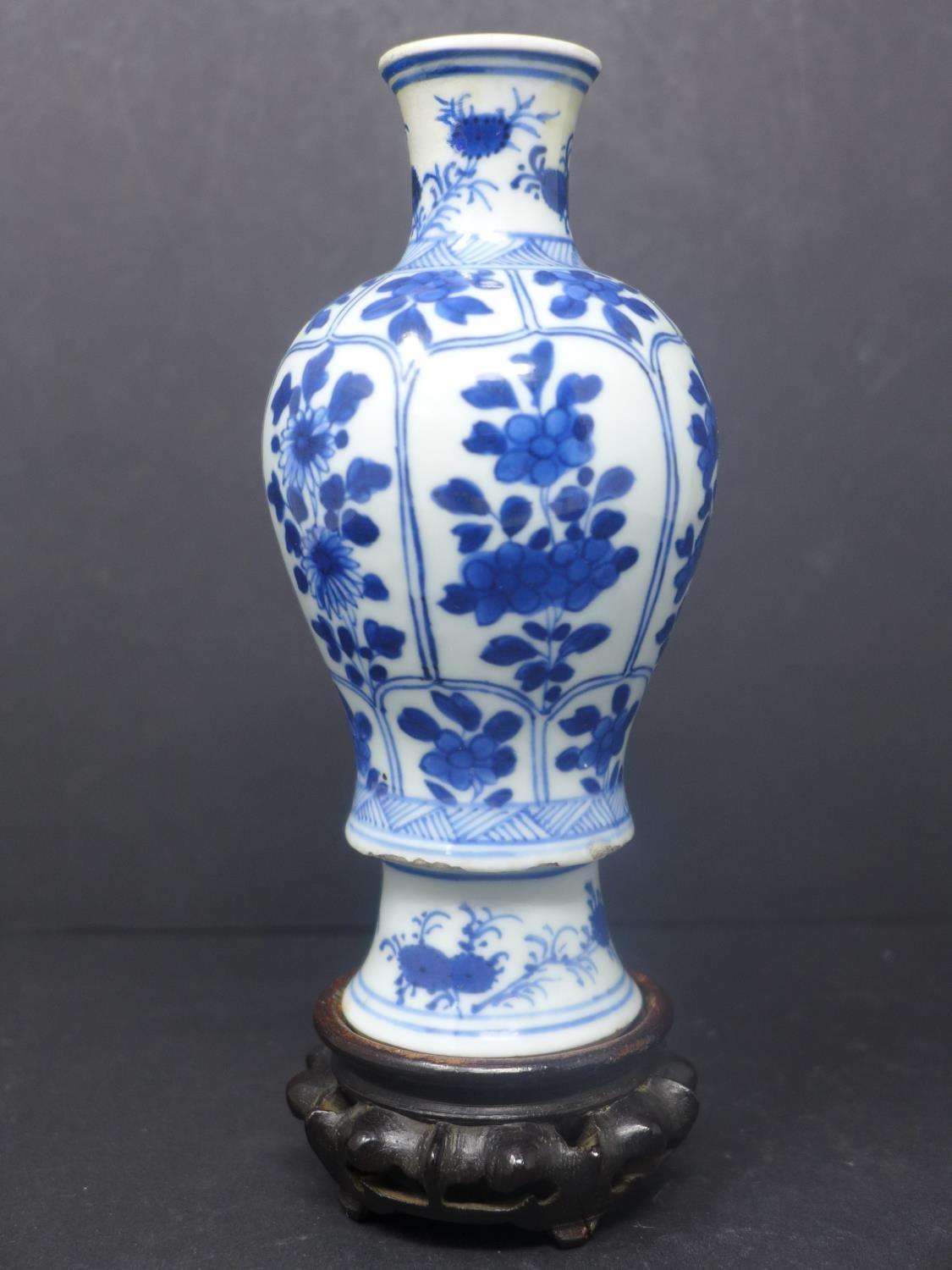A Chinese baluster vase, blue and white porcelain, floral design probably K?ang Hsi period with