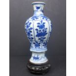 A Chinese baluster vase, blue and white porcelain, floral design probably K?ang Hsi period with