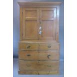 A 20th century pine dresser, with two cupboard doors above two short over two long drawers, on