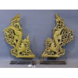 A pair of Southeast Asian carved gilt painted wooden panel, with pierced carving of dragons and