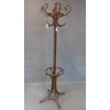 A 20th century mahogany coat stand, on outswept feet, H.198cm