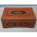 Large Burmese lacquered box richly decorated on the cover with a tiger and a Burmese inscriptions,