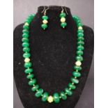 An emerald necklace and matching earrings, with gilt Kylin mounts