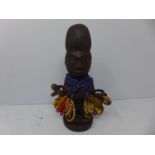 Yoruba Ibeji figure covered in glass beads, Nigeria 20th century, H.20 cm