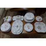 A collection of Spode Marlborough Spray dinnerware with bright multicoloured flowers on white,