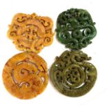 WITHDRAWN- Four Chinese hardstone pendants, decorated with dragons and scrolling folia