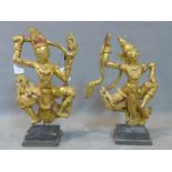 Two Southeast Asian gilt painted wooden figures, holding ruyi scepters, raised on stepped square