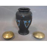 A Japanese vase with two small brass round containers