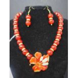 A red carnelian, gold plated and cubic zirconia set necklace, with floral pendant brooch, together