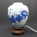 A Chinese vase, blue and white porcelain, floral design, probably 19th century with stand in