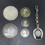 Five coins including, a coin mounted white metal pendant, silver coin with Victorian coin, George V,