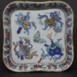 A Chinese square dish, porcelain, with rounded corners with polychrome motifs of the Taoist