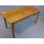 A pine kitchen table, on square tapered legs, H.76 W.158 D.77cm