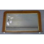 An inlaid overmantle mirror with original glass plate, on ceramic ball feet, 49 x 85cm