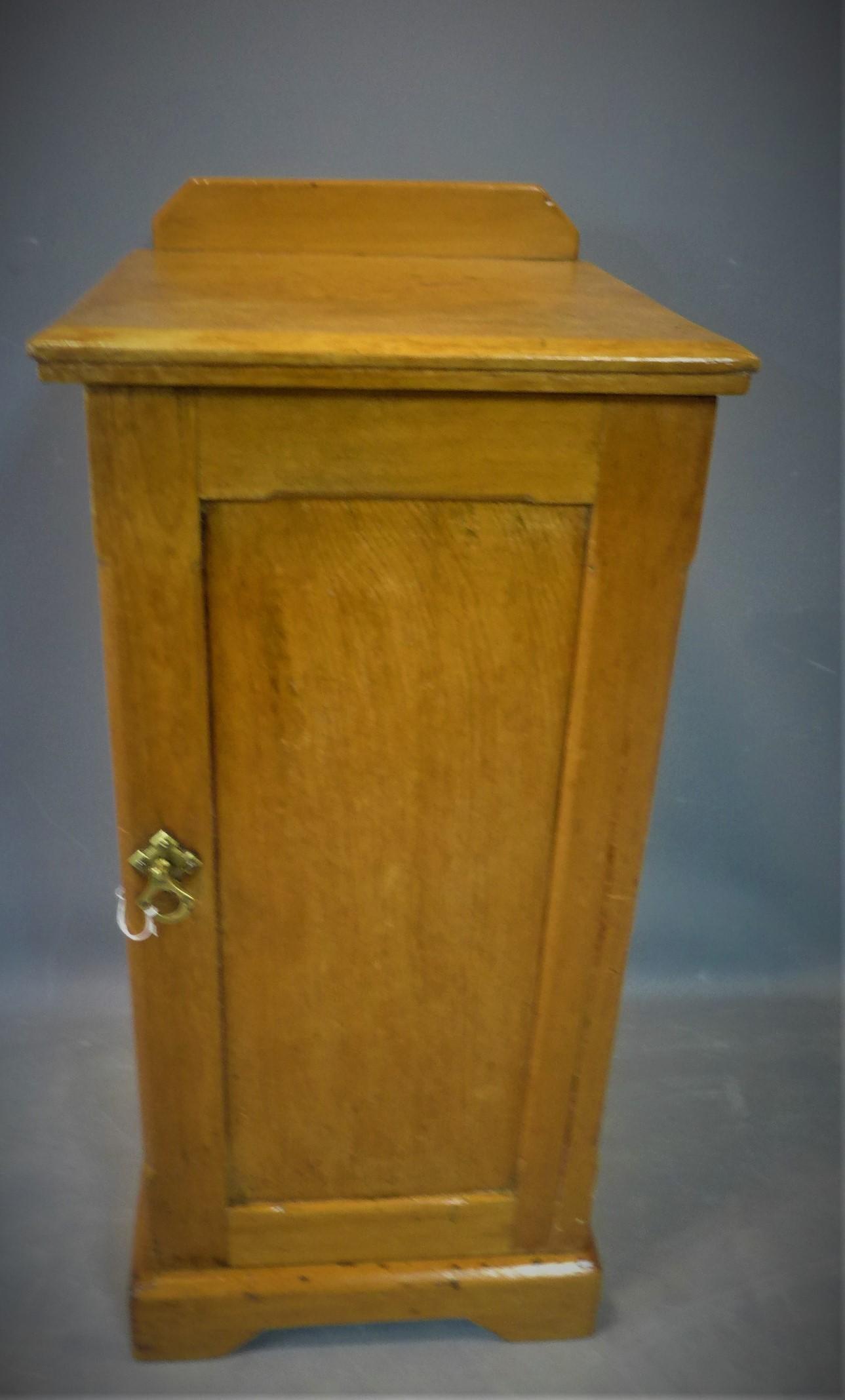 A Victorian pitch pine bedside cupboard, H.85 W.38 D.38cm