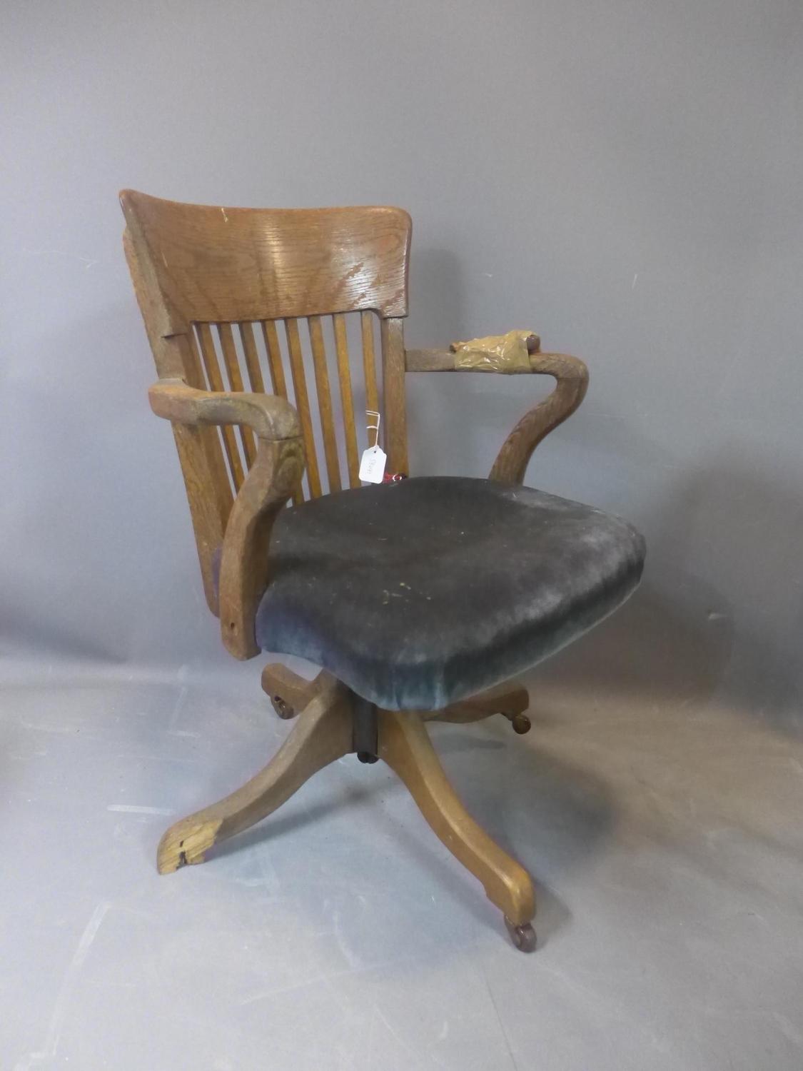 An early 20th century oak swivel desk chair, raised on ceramic castors, (one foot broken - needs - Image 2 of 2