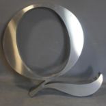 A large stainless steel letter Q, H.110 W.115cm