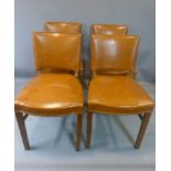 A set of four early 20th century mahogany and brown leather chairs