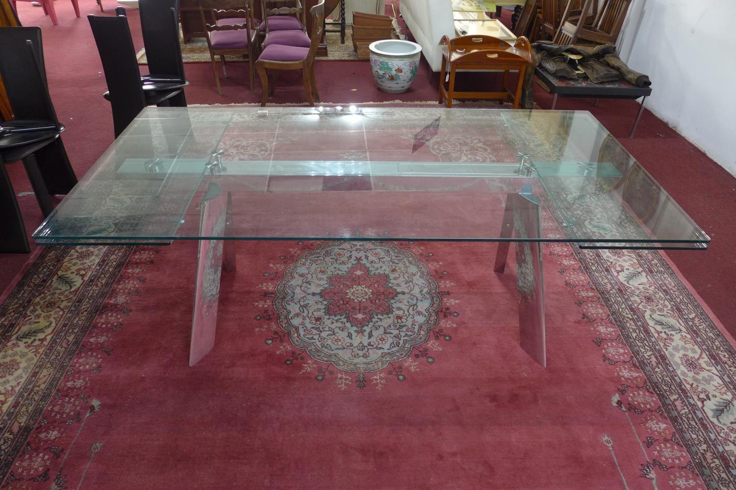 An Italian extending glass dining table by Naos, H.74 W.200 D.100cm (not extended)