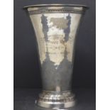 An early 20th century silver vase of tapering form, raised on circular base, engraved '