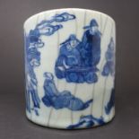 A Chinese crackle glazed brush pot, decorated in blue with seated figures, H.15.5cm Diameter 16.5cm