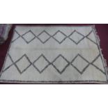 A Moroccan Berber Beni Ourain carpet, with double diamond design, 326 x 219cm