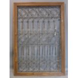 A Moroccan window panel, with no glass, with wooden frame and pierced wrought iron panel, 156 x