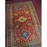 WITHDRAWN- A Pakistani Bokhara rug, 5 diamond medallions on a light brown ground, within stylised