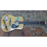 A classical guitar with stickers and stencils for 'The School of Rock' movie, signed and inscribed