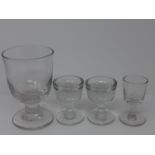 Four 19th Century glasses, including a large rummer, H.14cm, a pair of two penny licks, H.8.3cm,