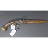 Gun with wooden body and brass animal motifs