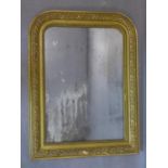 A French Empire giltwood mirror, with beaded and floral decorated giltwood frame and ghosted glass