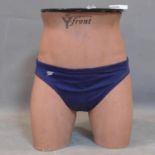 An unusual lamp table made from a half mannequin wearing speedos, marked Coopers Y Front, H.38cm