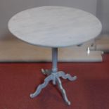 A 19th century blue painted French centre table on quadruped supports