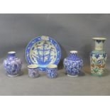 A collection of Turkish pottery, to include two vases (one repaired); two cups, and a baluster