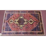 A north west Persian Afshar rug, 240cm x 160cm, triple polo medallion, with repeating geometrical