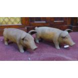 Two cast iron pigs, H.18 W.43 D.15cm