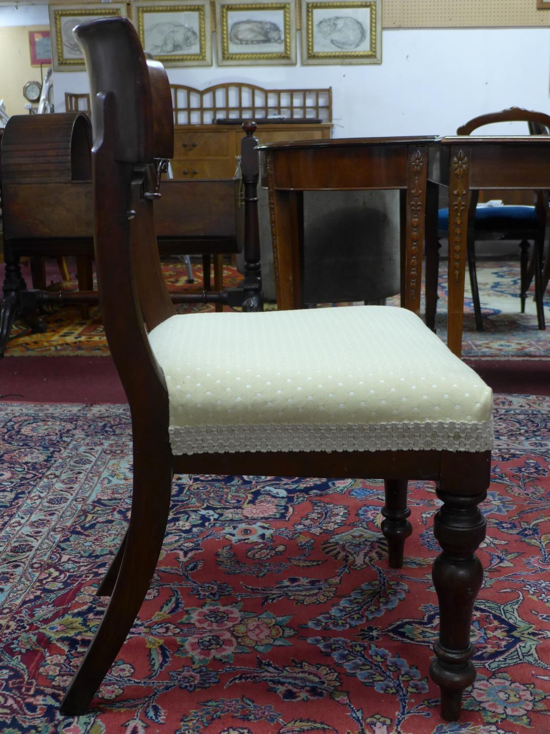 A set of four mahogany William IV dining chairs, with cream upholstered seats, on turned legs, label - Image 4 of 6