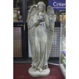 A cast plaster angel holding a bird, H.121cm