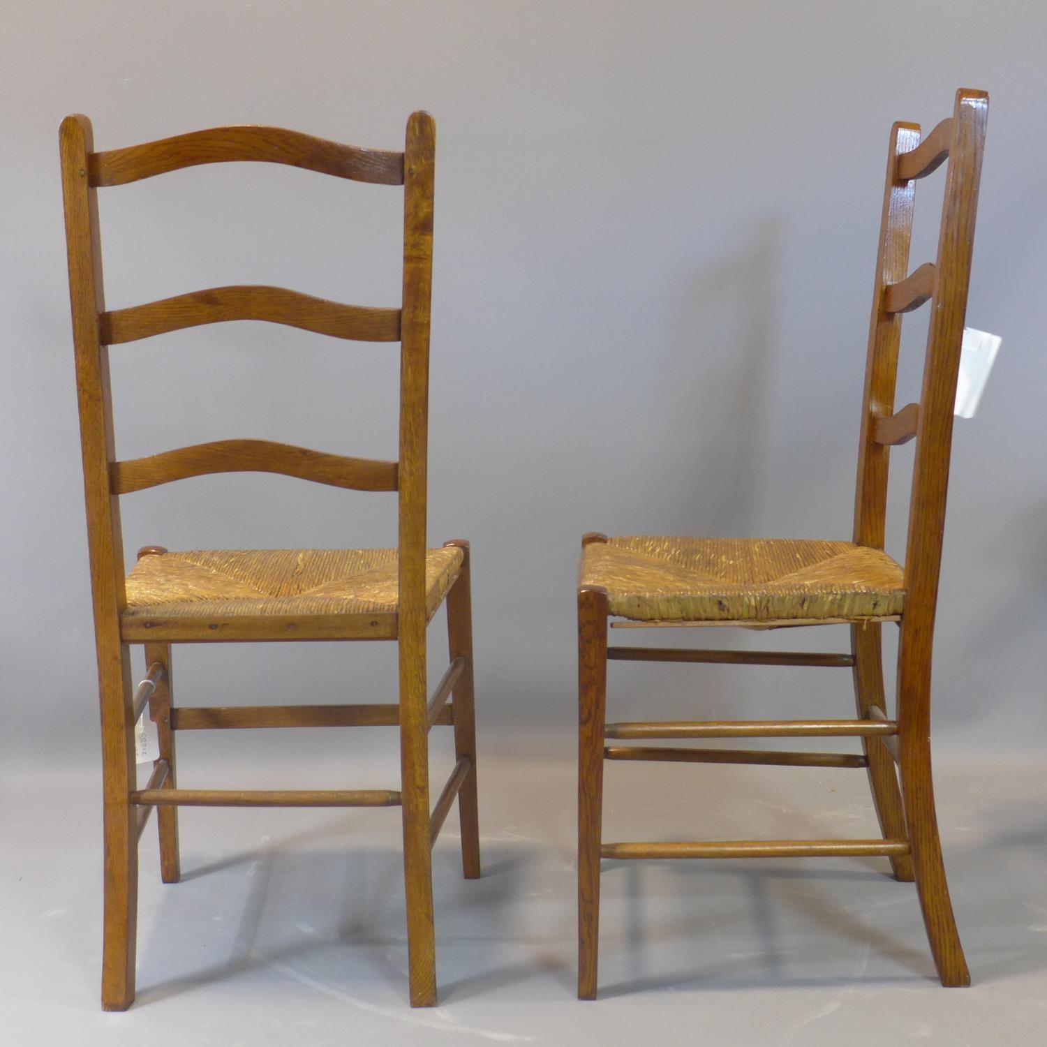 A pair of oak ladderback chairs with rush seats - Image 2 of 2