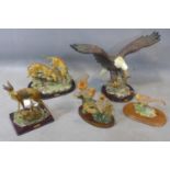 Five moulded animal ornaments, to include an eagle catching a fish, H.33 W.46cm, three robins on a